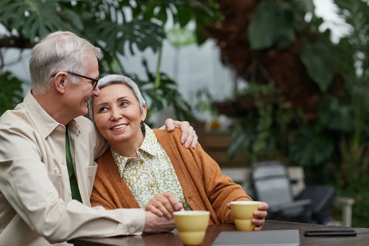 couple hugging and smiling at each other