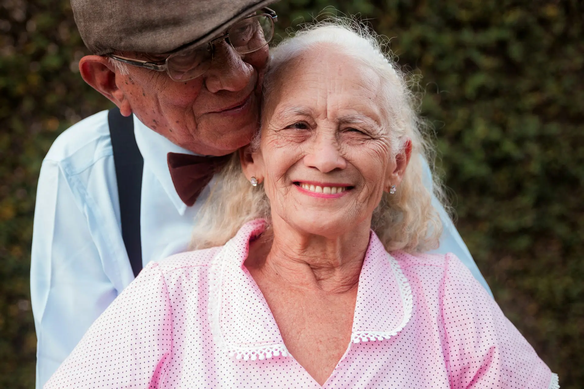older woman with long hair and smiling happily