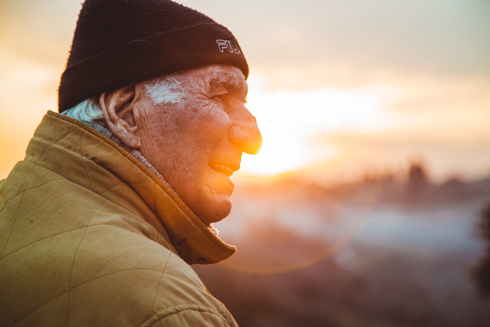 waterpik vs flossing - older man watching sunset