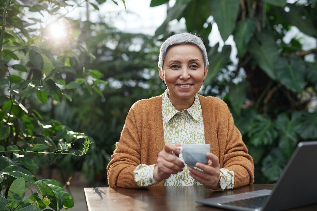 what is a fixed dental bridge - senior woman drinking tea