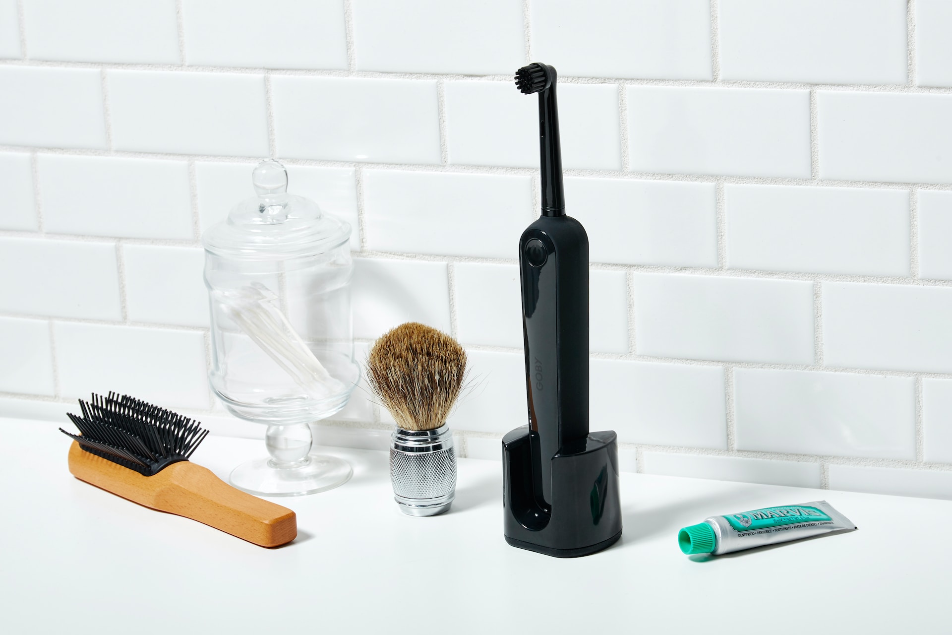 electric toothbrush and other toiletries on counter